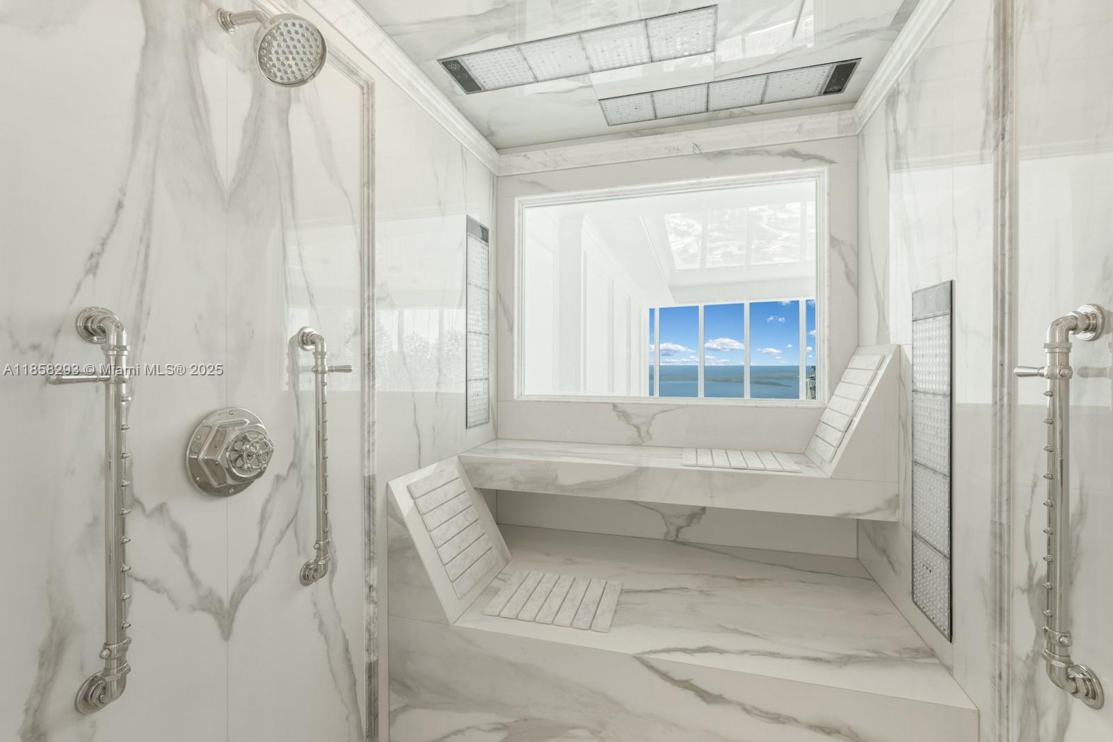 888 Biscayne Boulevard, Unit 5701 Miami, FL 33132 - Photo 19 of 35 a bathroom with a tub and a shower
