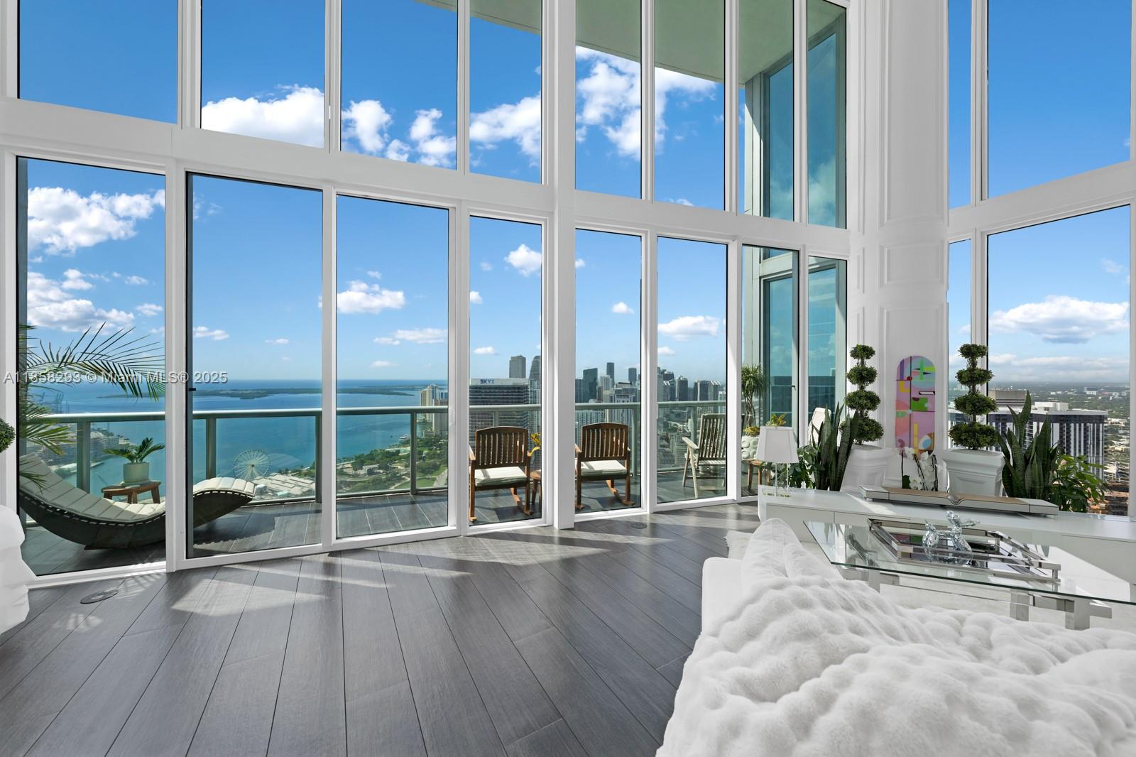 888 Biscayne Boulevard, Unit 5701 Miami, FL 33132 - Photo 2 of 35 a lobby with furniture and floor to ceiling windows