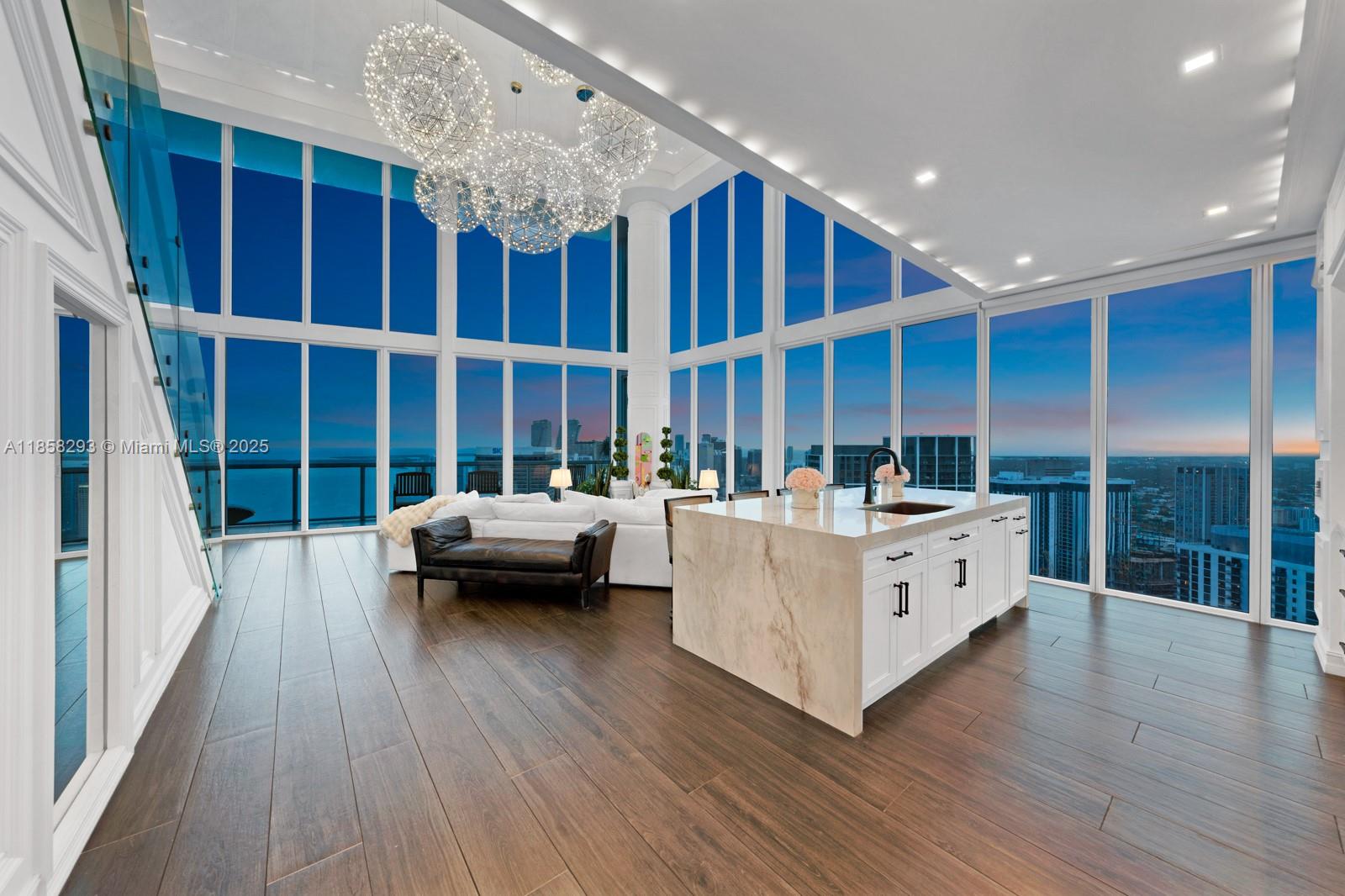 888 Biscayne Boulevard, Unit 5701 Miami, FL 33132 - Photo 27 of 35 a living room with furniture and a large window