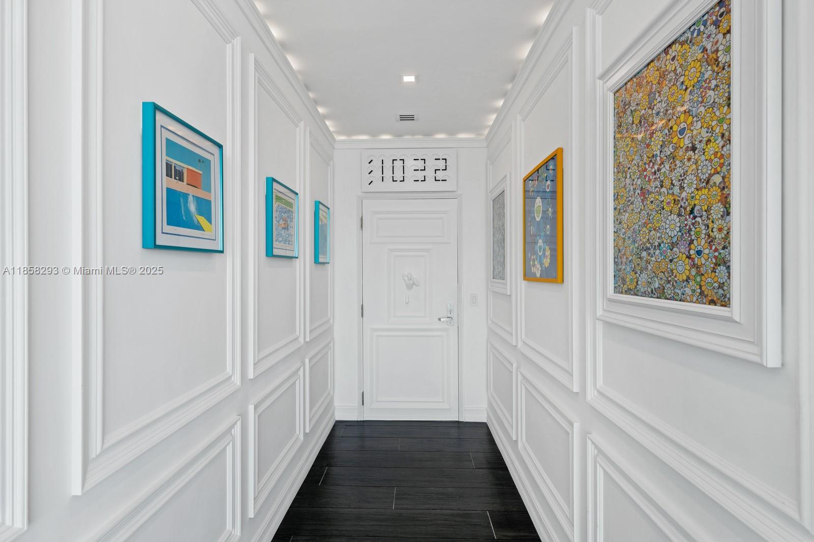 888 Biscayne Boulevard, Unit 5701 Miami, FL 33132 - Photo 35 of 35 a view of a hallway with wooden floor and windows