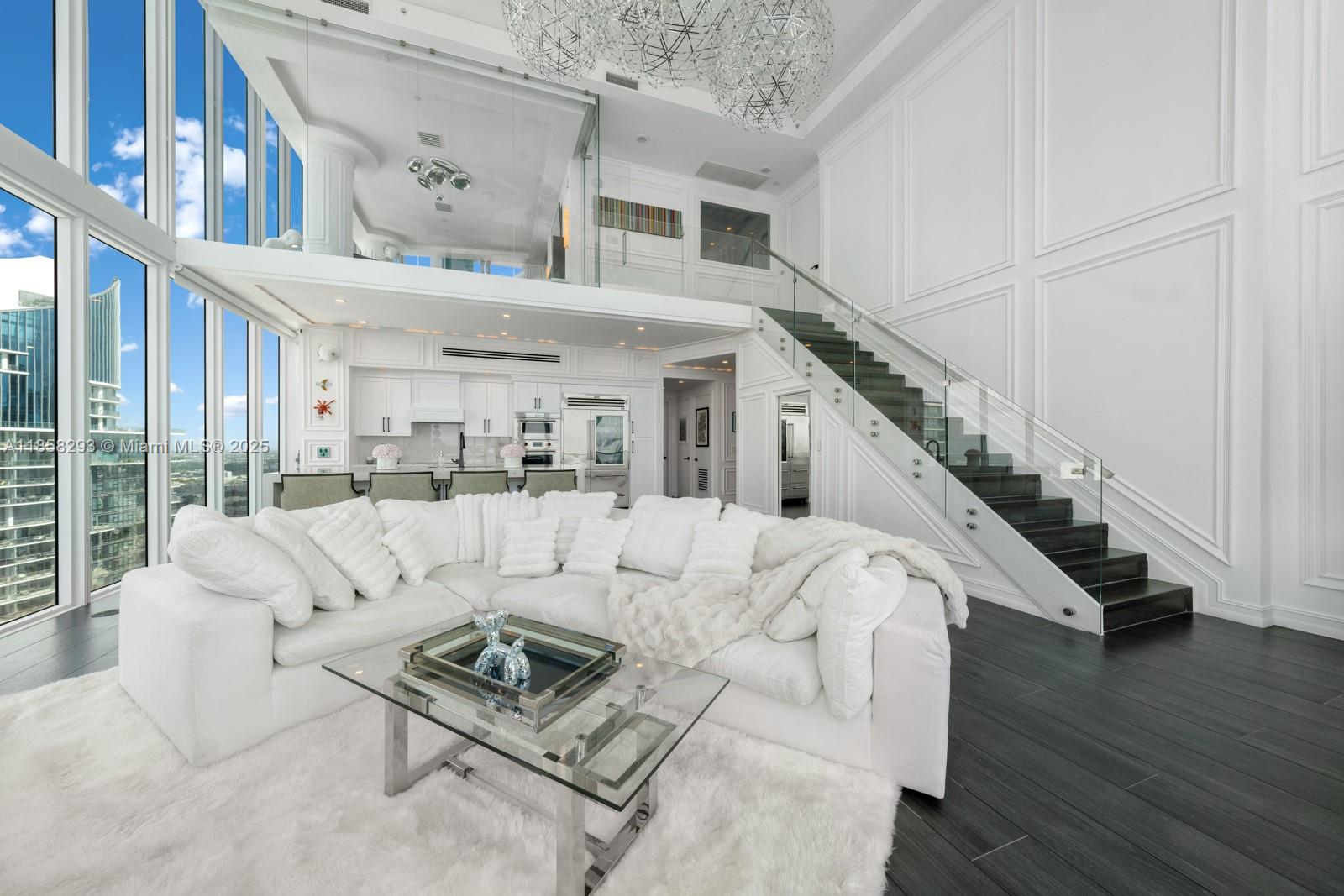 888 Biscayne Boulevard, Unit 5701 Miami, FL 33132 - Photo 7 of 35 a living room with furniture and wooden floor