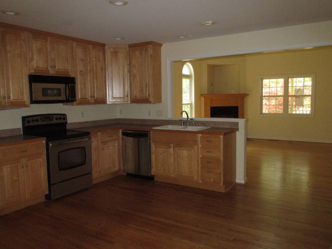 71 Laguna Road Palmyra, VA 22963 - Photo 3 of 10 a kitchen with stainless steel appliances granite countertop a stove a sink and a microwave