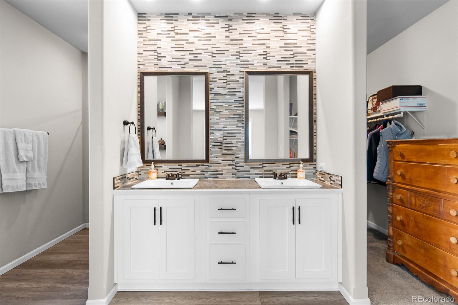 11374 Ridgewood Way Kiowa, CO 80117 - Photo 26 of 49 a bathroom with a granite countertop sink and a mirror