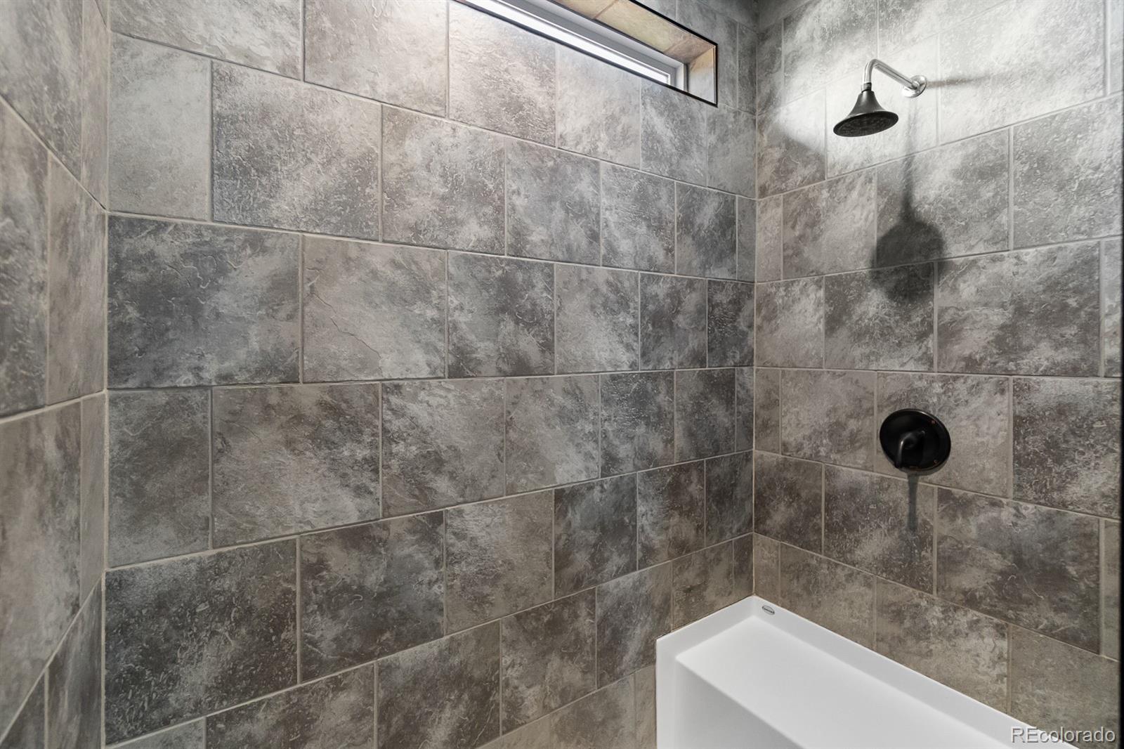 11374 Ridgewood Way Kiowa, CO 80117 - Photo 27 of 49 a bathroom with a shower