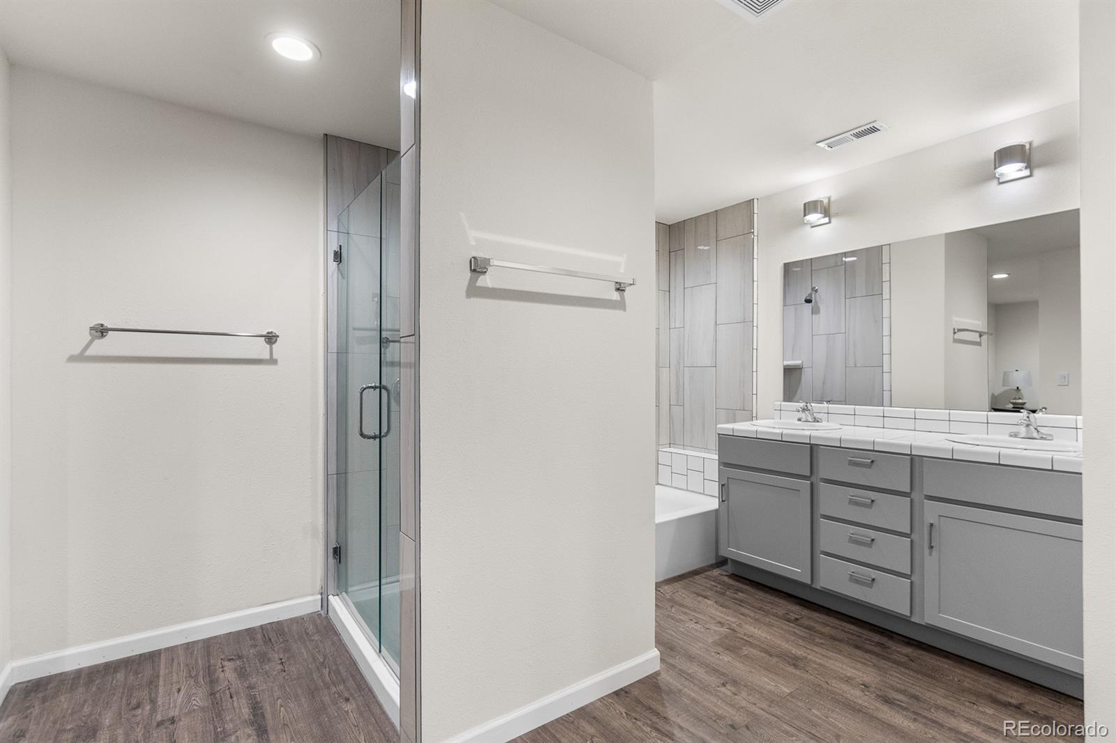 11374 Ridgewood Way Kiowa, CO 80117 - Photo 36 of 49 a bathroom with a sink a mirror and a shower