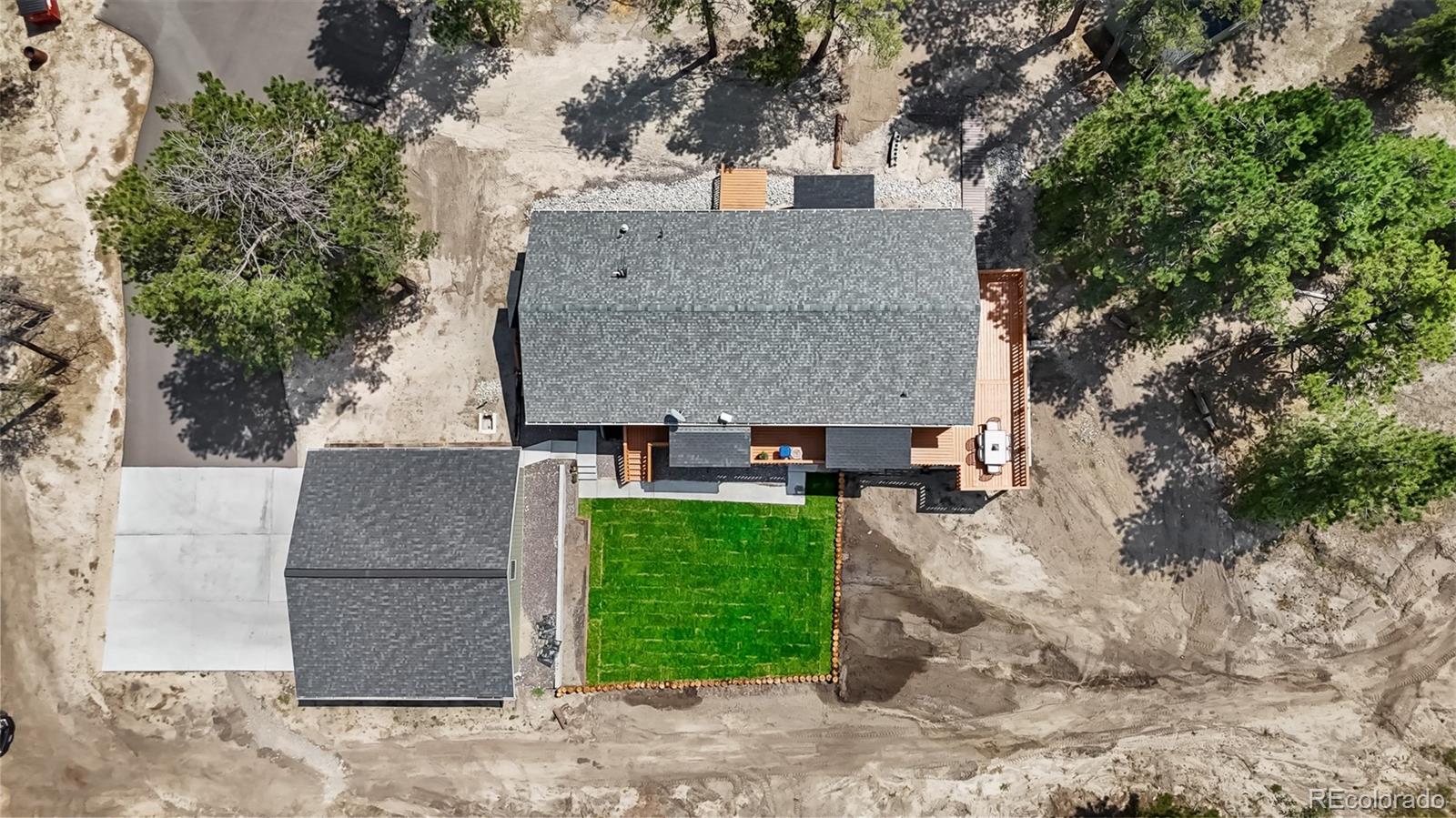 11374 Ridgewood Way Kiowa, CO 80117 - Photo 5 of 49 a aerial view of a house with a yard and large tree