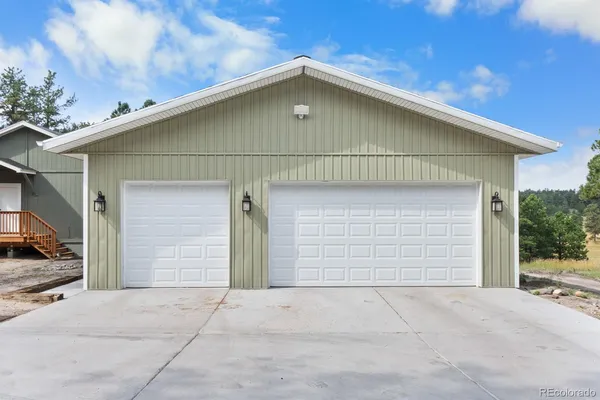 a front view of a house with garage