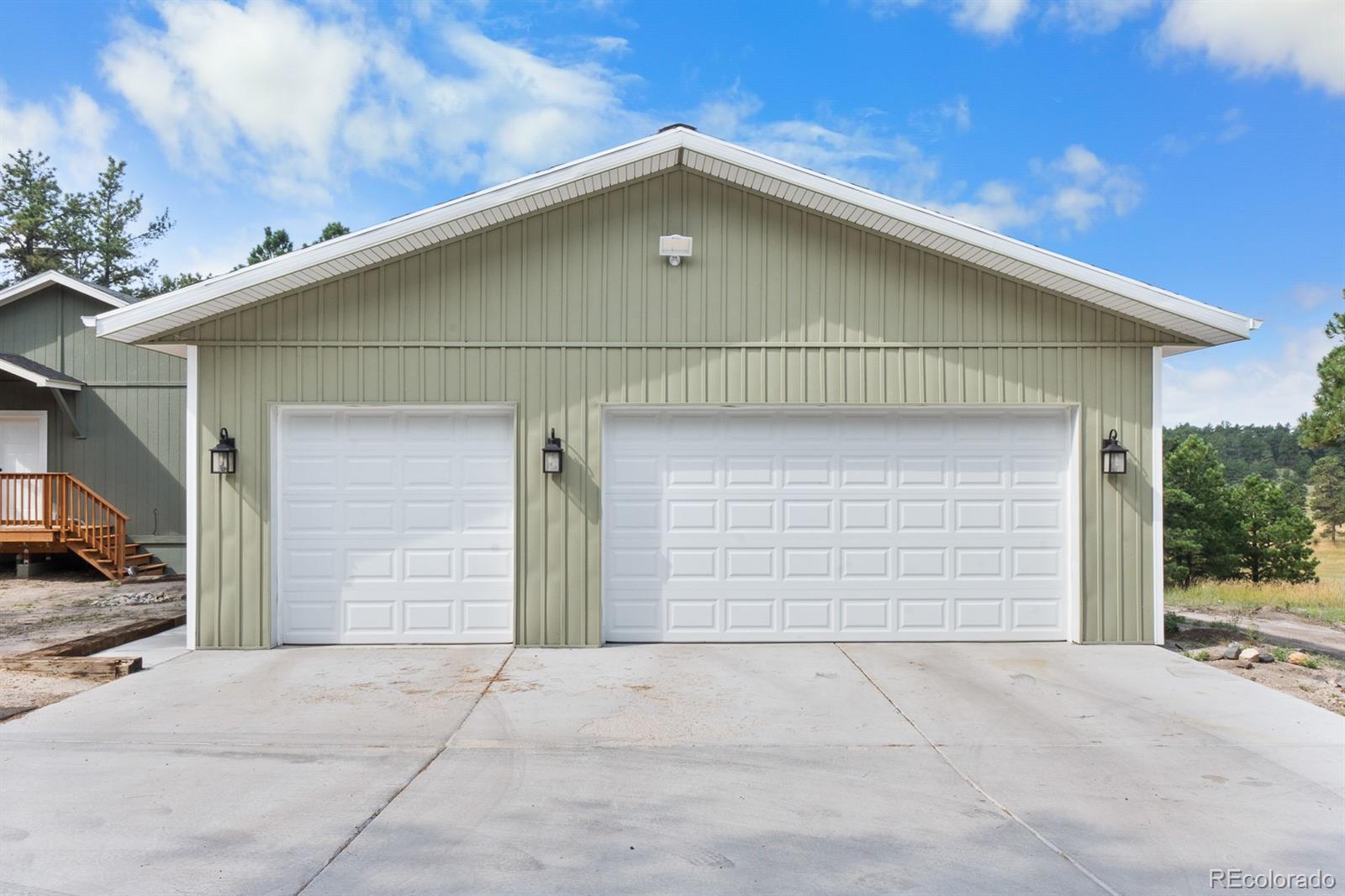 11374 Ridgewood Way Kiowa, CO 80117 - Photo 6 of 49 a front view of a house with garage