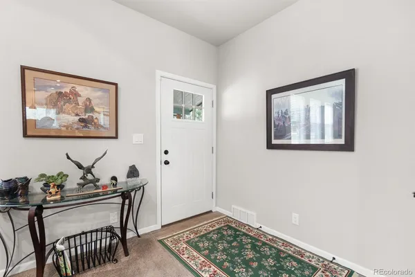 a view of a livingroom with furniture