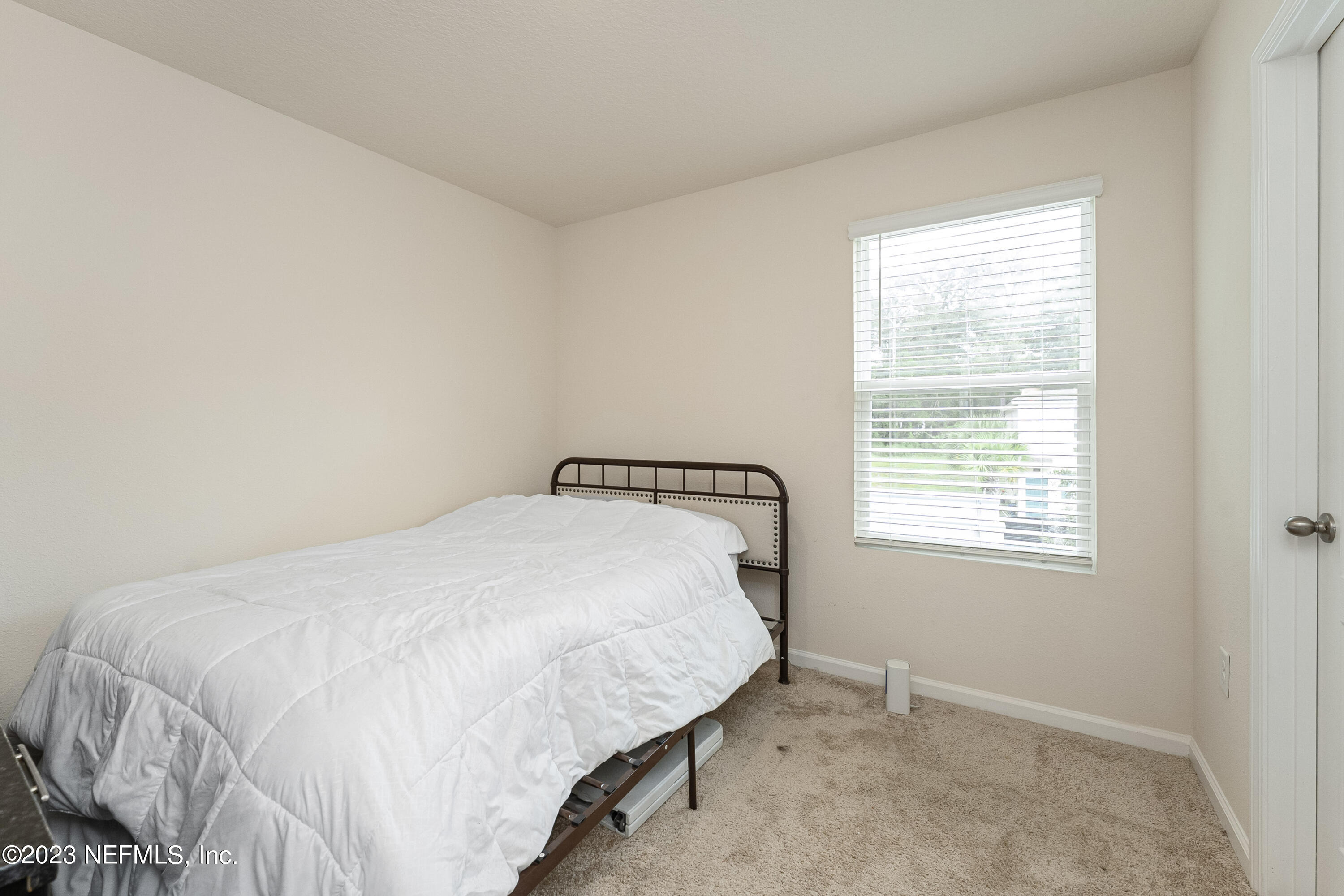954 Rotary Road Jacksonville, FL 32211 - Photo 12 of 18 a bedroom with a bed and a window