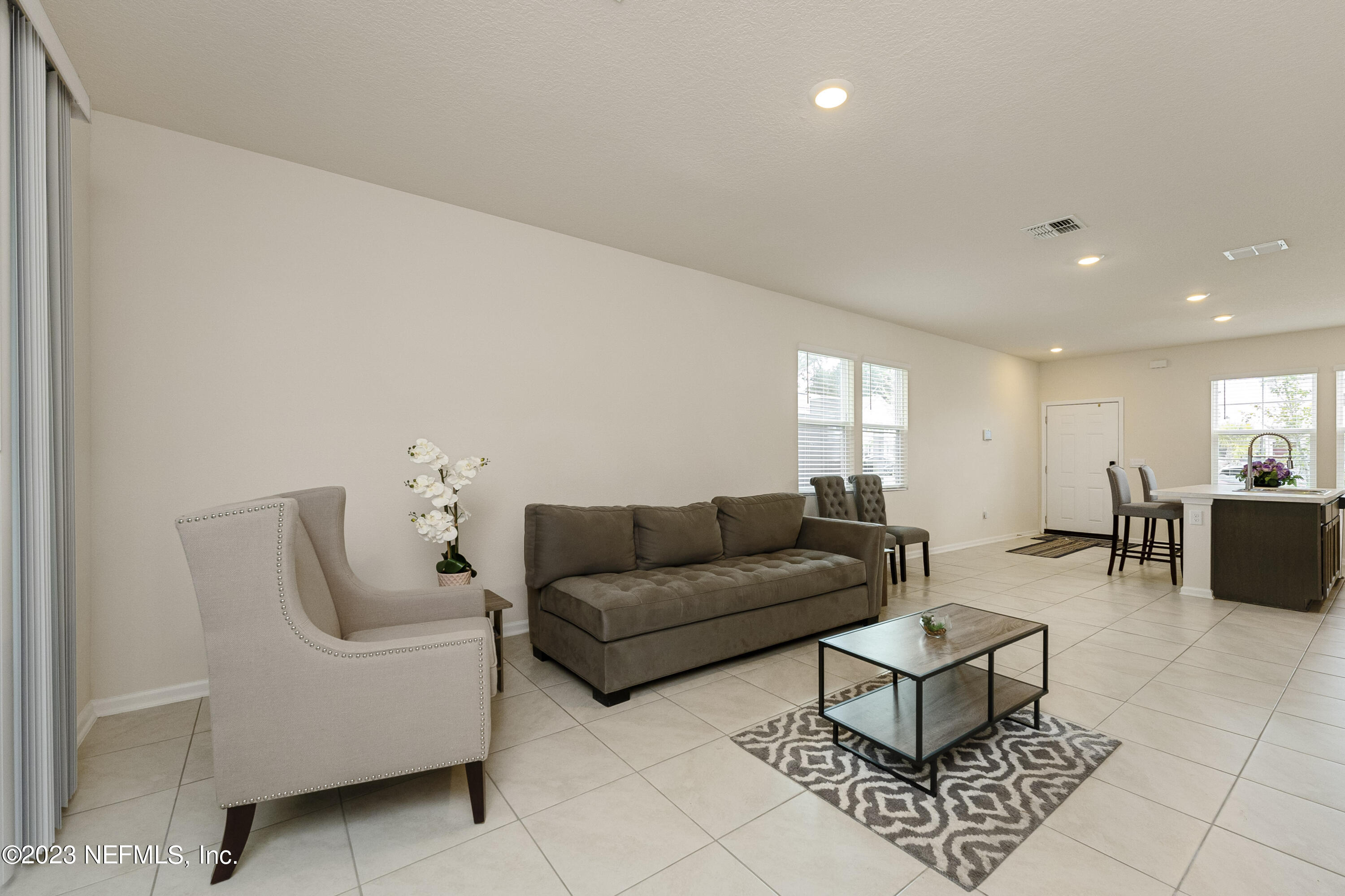 954 Rotary Road Jacksonville, FL 32211 - Photo 6 of 18 a living room with furniture and wooden floor