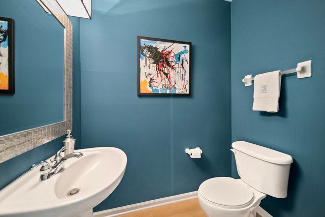 600 North Dearborn Street, Unit 1102 Chicago, IL 60654 - Photo 16 of 26 a bathroom with a toilet a sink and mirror