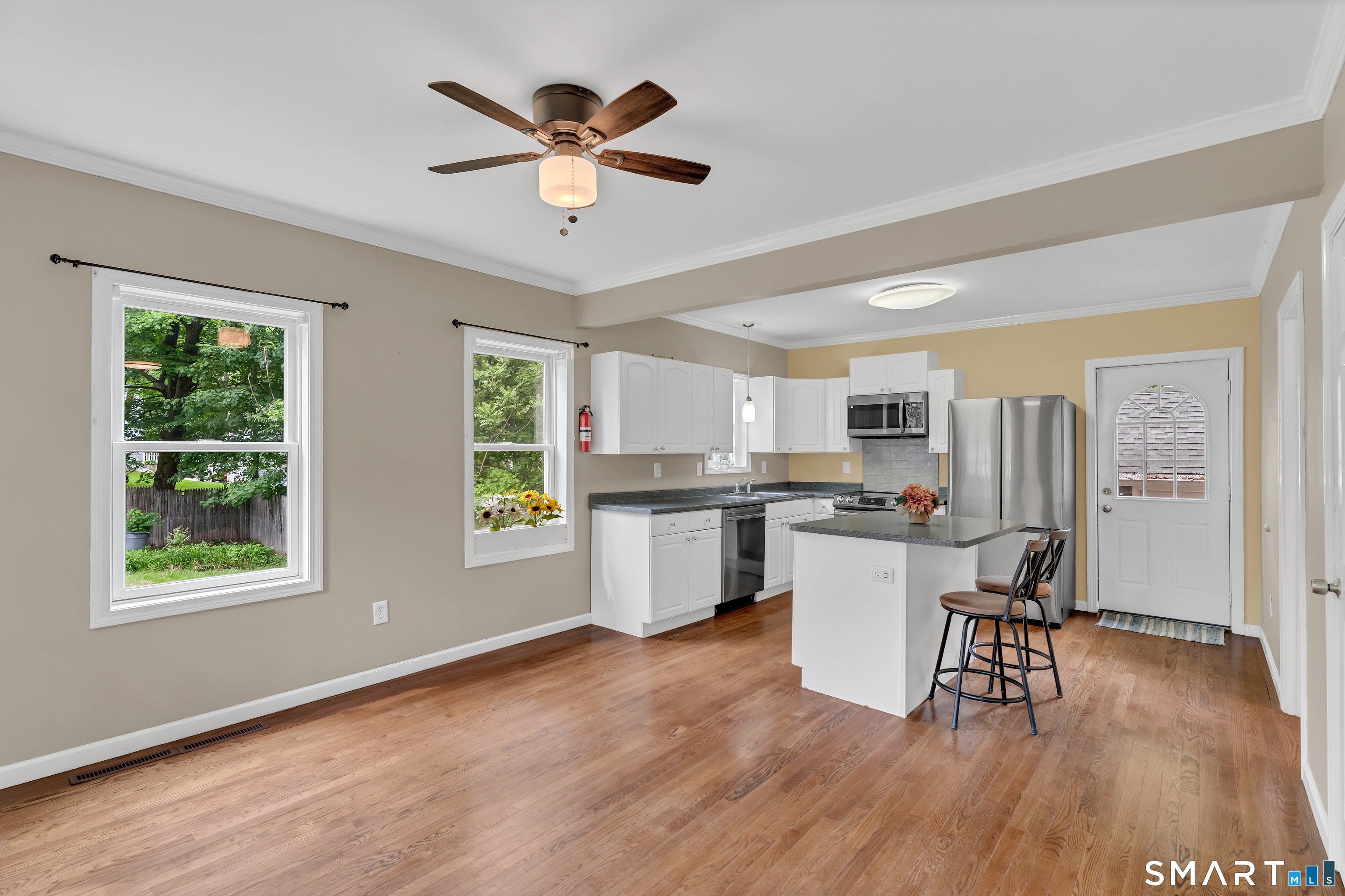 75 Summit Street Norwich, CT 06360 - Photo 23 of 40 a kitchen with a wooden floor and a window