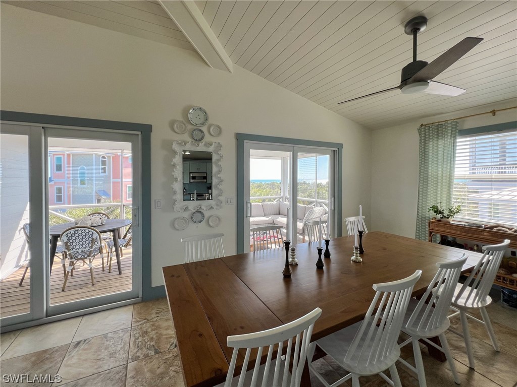 4480 Panama Shell Drive Upper Captiva, FL 33924 - Photo 12 of 50 a view of a dining room with furniture window and outside view