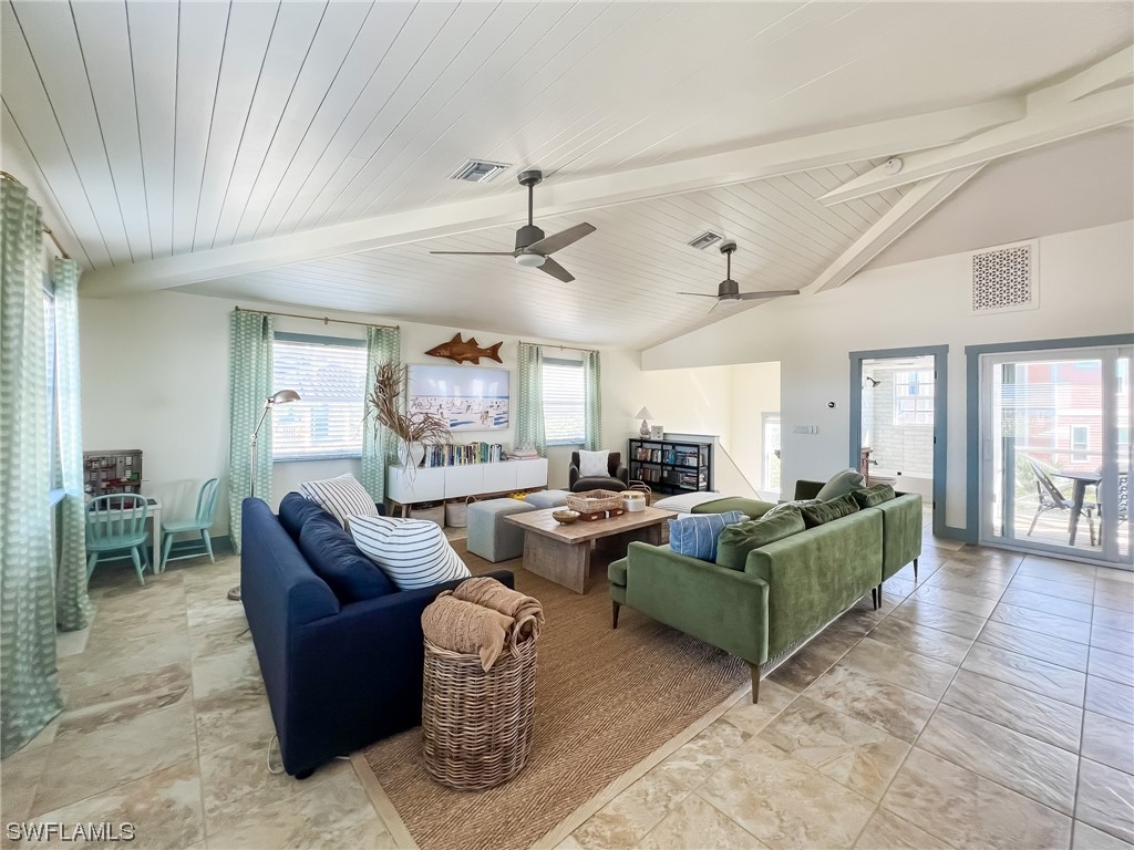 4480 Panama Shell Drive Upper Captiva, FL 33924 - Photo 14 of 50 a living room with furniture and a large window
