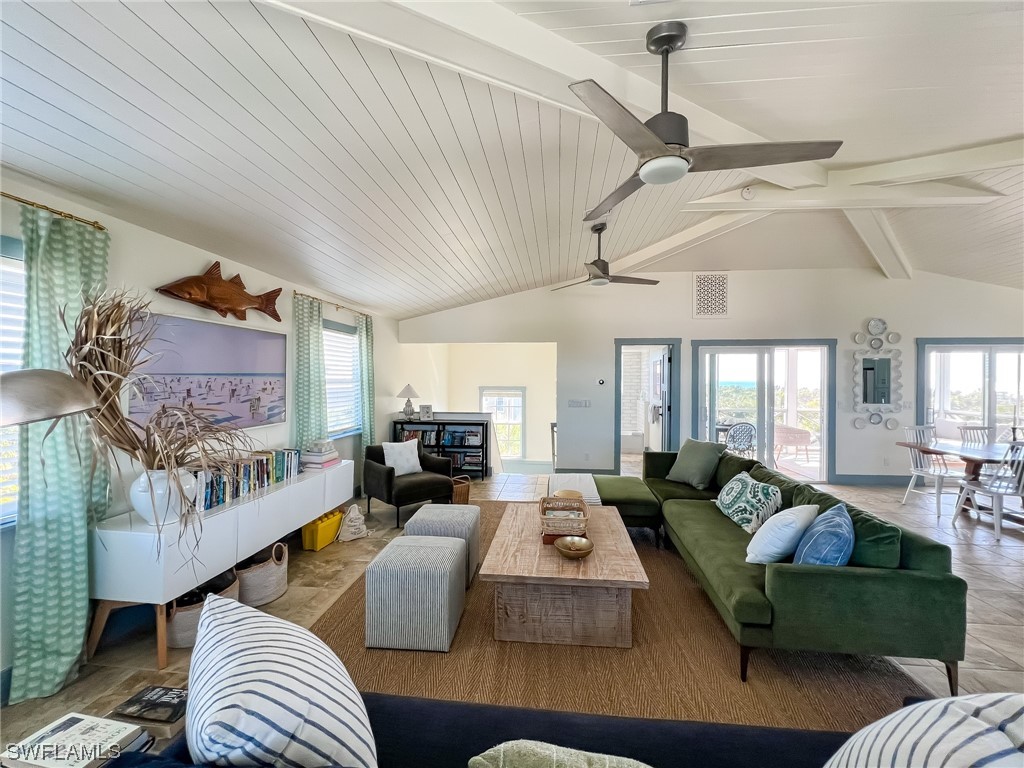 4480 Panama Shell Drive Upper Captiva, FL 33924 - Photo 16 of 50 a living room with furniture and a fireplace
