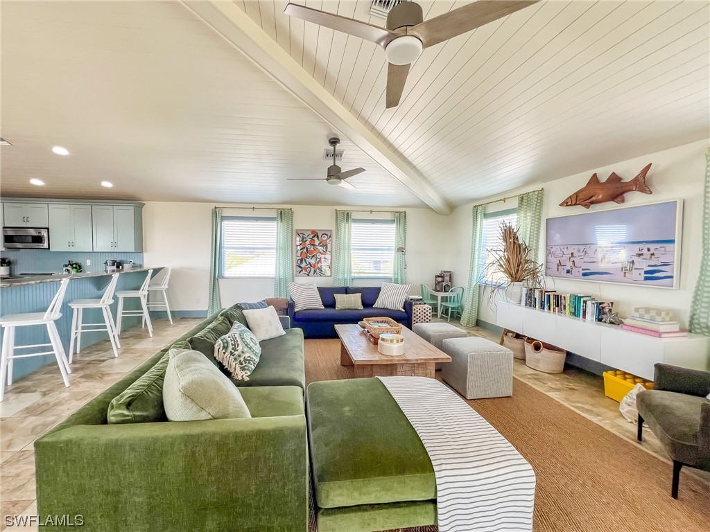 4480 Panama Shell Drive Upper Captiva, FL 33924 - Photo 18 of 50 a living room with furniture and a large window