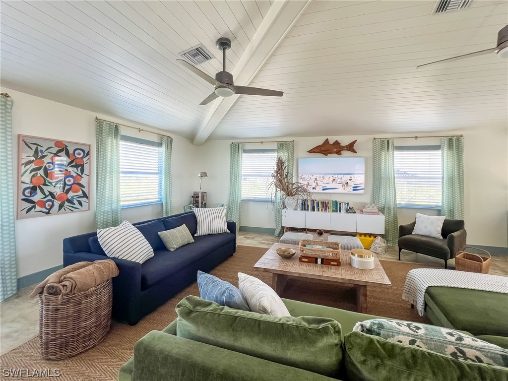 4480 Panama Shell Drive Upper Captiva, FL 33924 - Photo 19 of 50 a living room with furniture ceiling fan and a window
