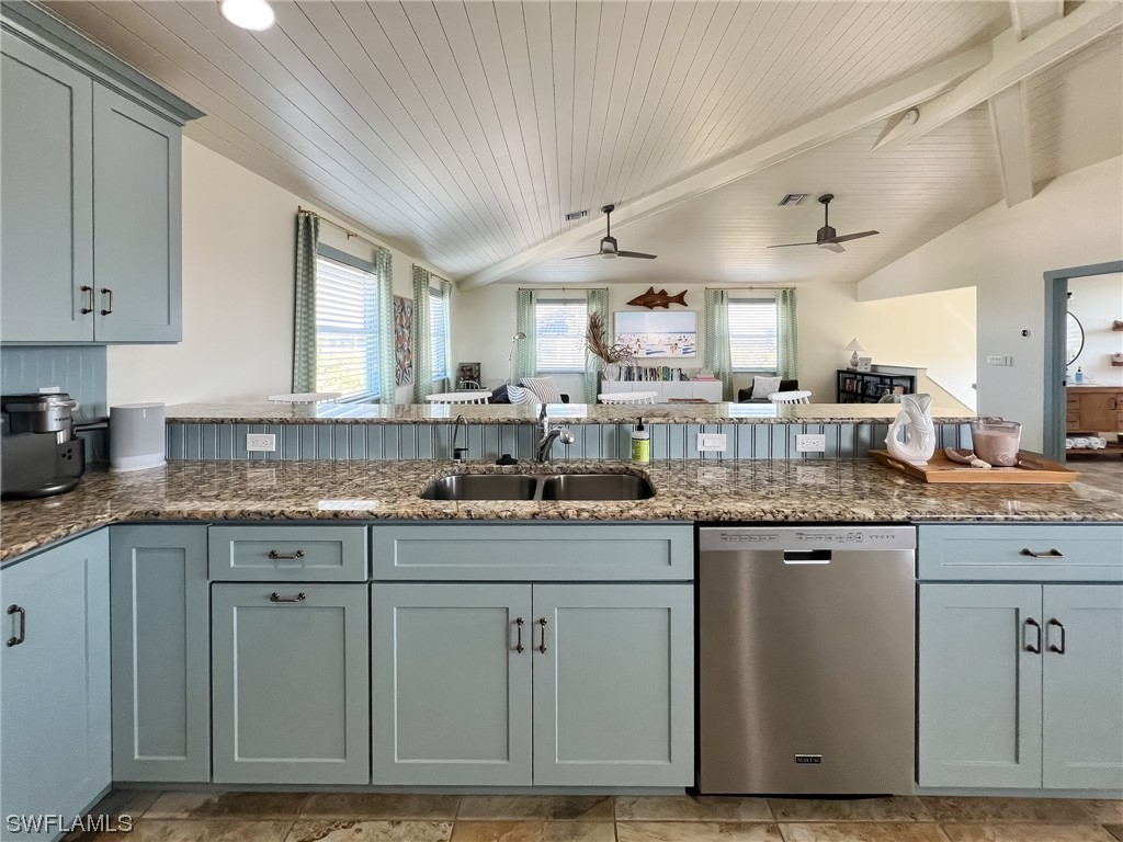 4480 Panama Shell Drive Upper Captiva, FL 33924 - Photo 25 of 50 a kitchen with granite countertop a sink and cabinets