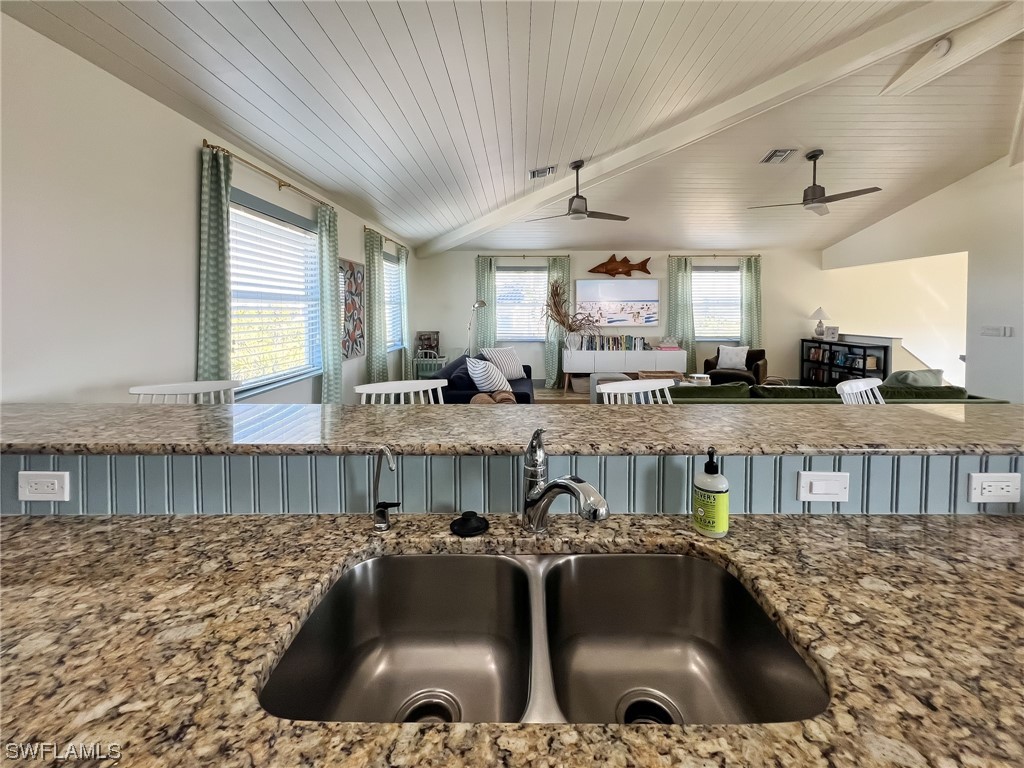 4480 Panama Shell Drive Upper Captiva, FL 33924 - Photo 27 of 50 a kitchen with a sink stove and cabinets
