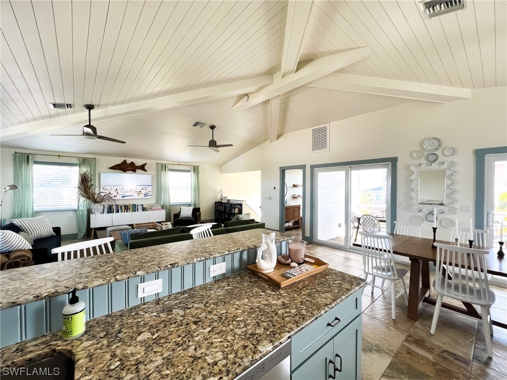 4480 Panama Shell Drive Upper Captiva, FL 33924 - Photo 28 of 50 a large living room with lots of furniture and flat screen tv