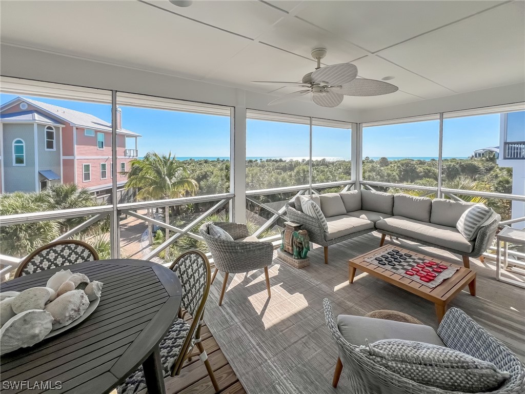 4480 Panama Shell Drive Upper Captiva, FL 33924 - Photo 30 of 50 a living room with furniture and a large window