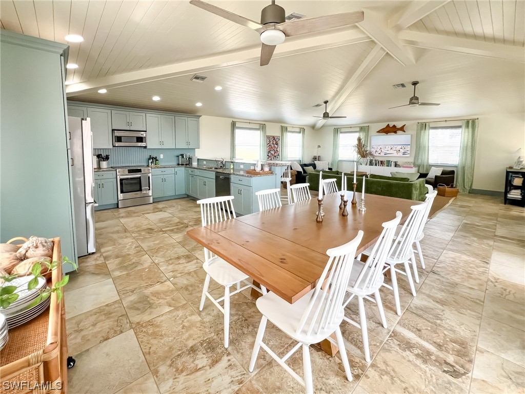 4480 Panama Shell Drive Upper Captiva, FL 33924 - Photo 31 of 50 a dining room with lots of tables and chairs