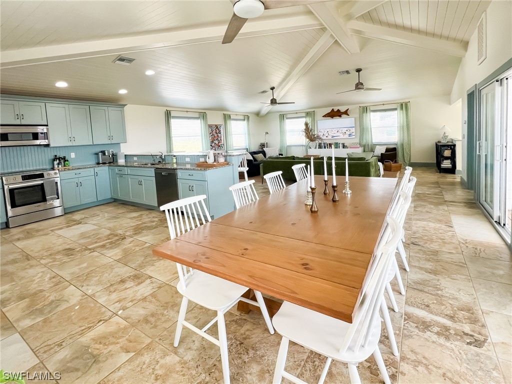4480 Panama Shell Drive Upper Captiva, FL 33924 - Photo 35 of 50 a large kitchen with a table and chairs