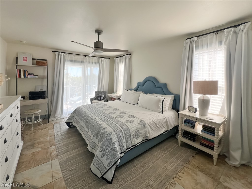 4480 Panama Shell Drive Upper Captiva, FL 33924 - Photo 38 of 50 a bedroom with a bed and a window