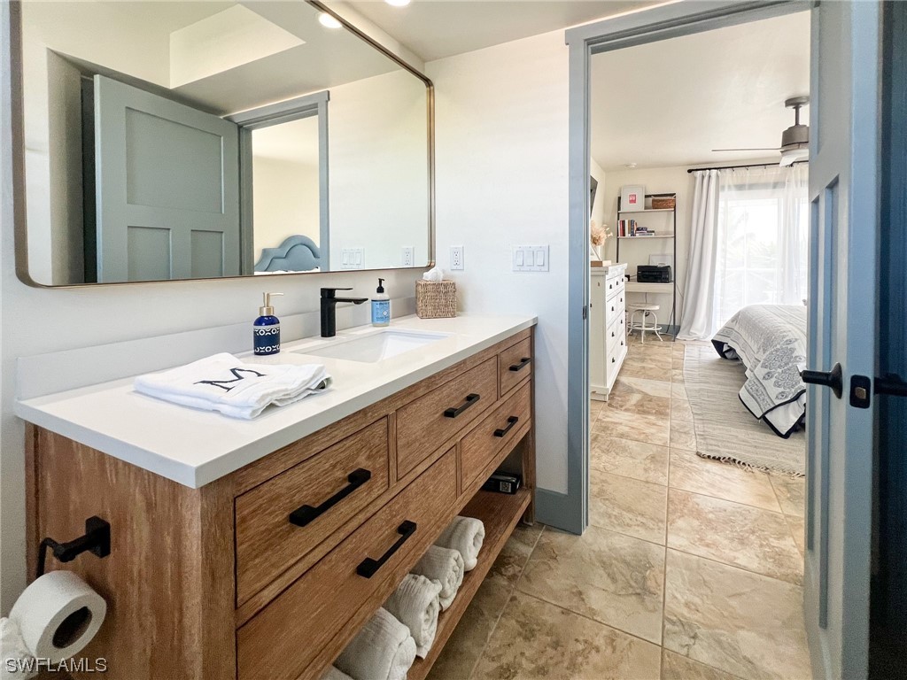 4480 Panama Shell Drive Upper Captiva, FL 33924 - Photo 39 of 50 a bathroom with a sink and a mirror