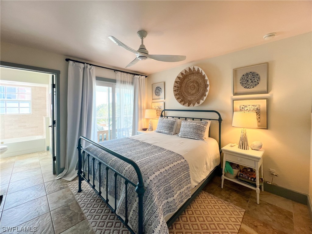 4480 Panama Shell Drive Upper Captiva, FL 33924 - Photo 43 of 50 a bedroom with a bed and a window