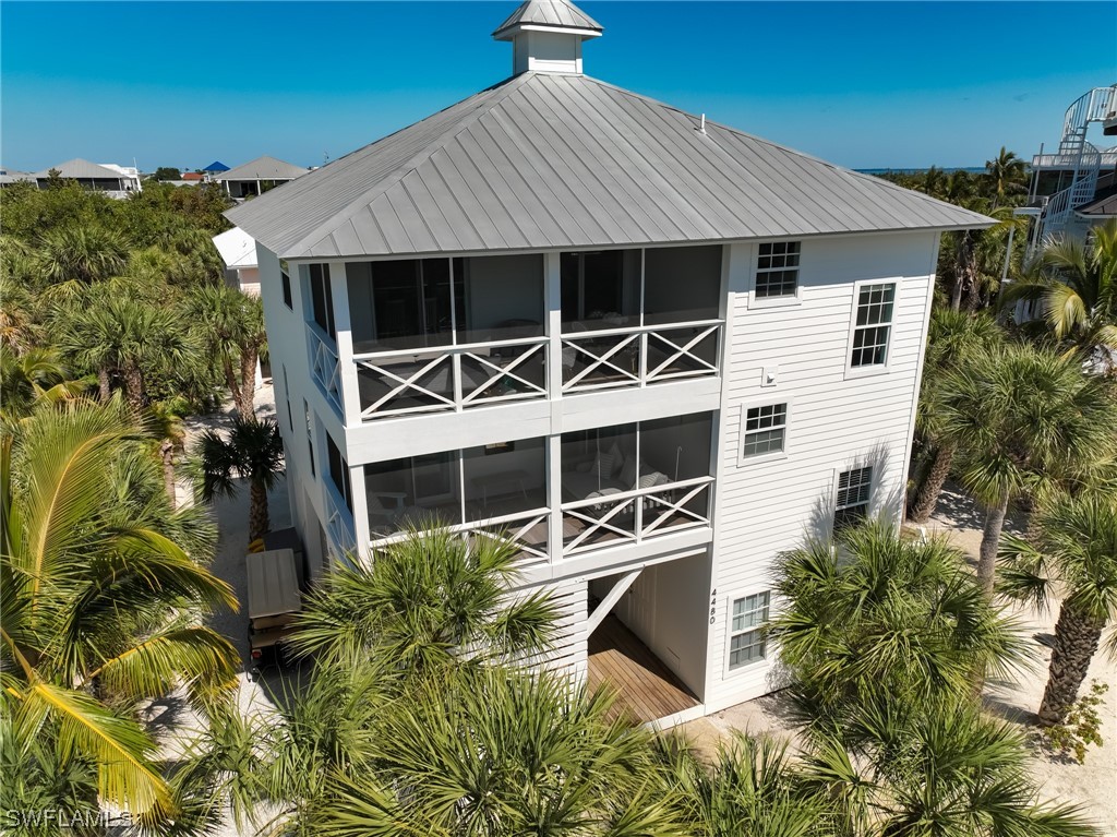 4480 Panama Shell Drive Upper Captiva, FL 33924 - Photo 6 of 50 front view of a house with a yard