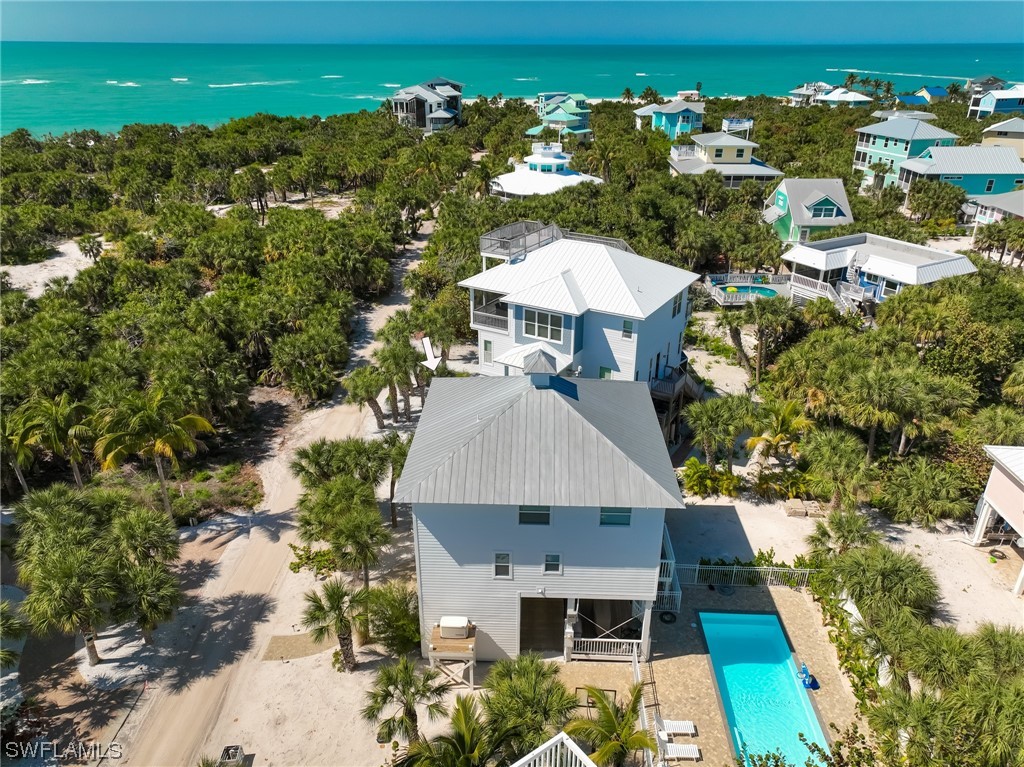 4480 Panama Shell Drive Upper Captiva, FL 33924 - Photo 7 of 50 an aerial view of a house with yard swimming pool and outdoor seating