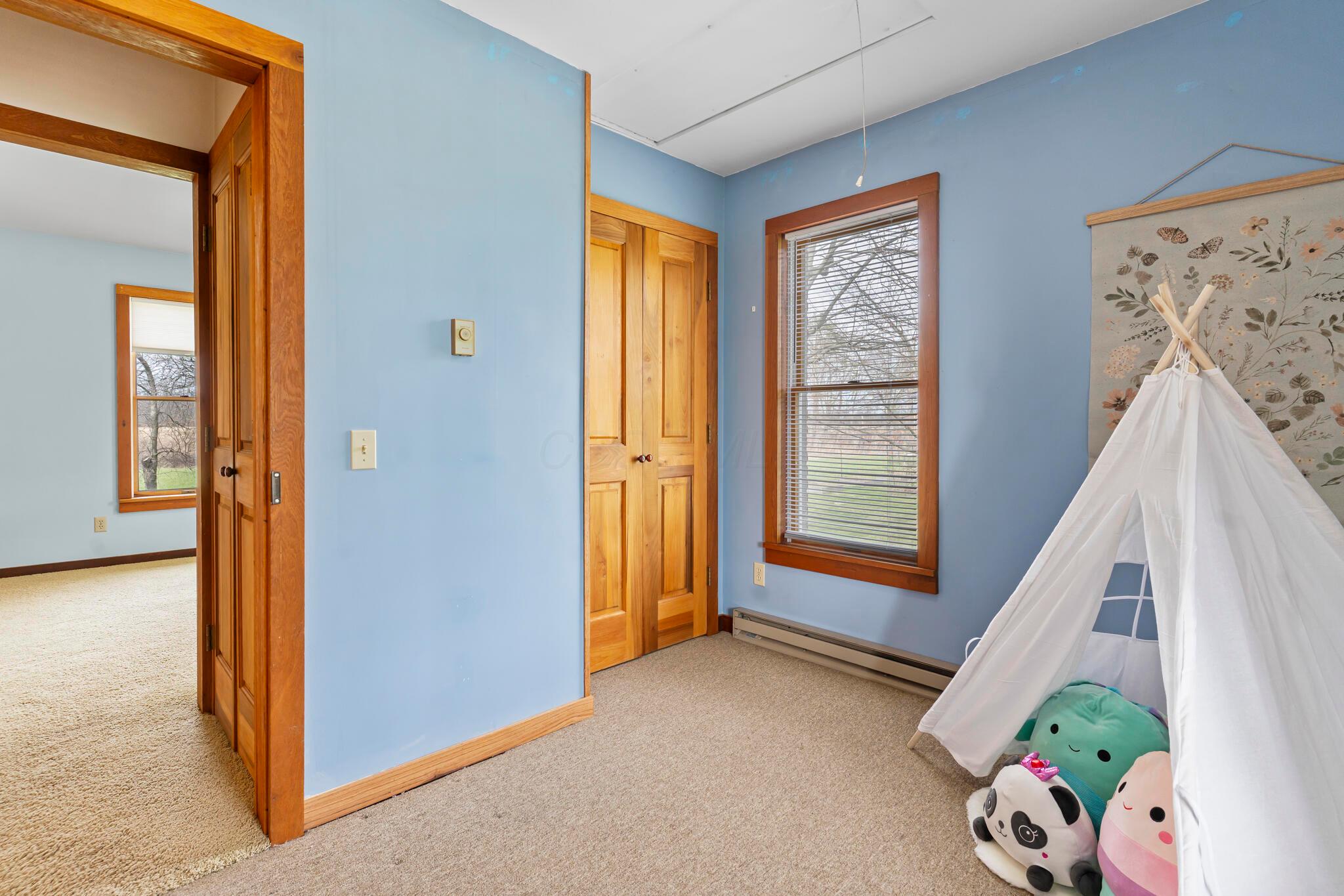 13535 Vans Valley Road Galena, OH 43021 - Photo 24 of 87 First floor bedroom #2 with attic storage access