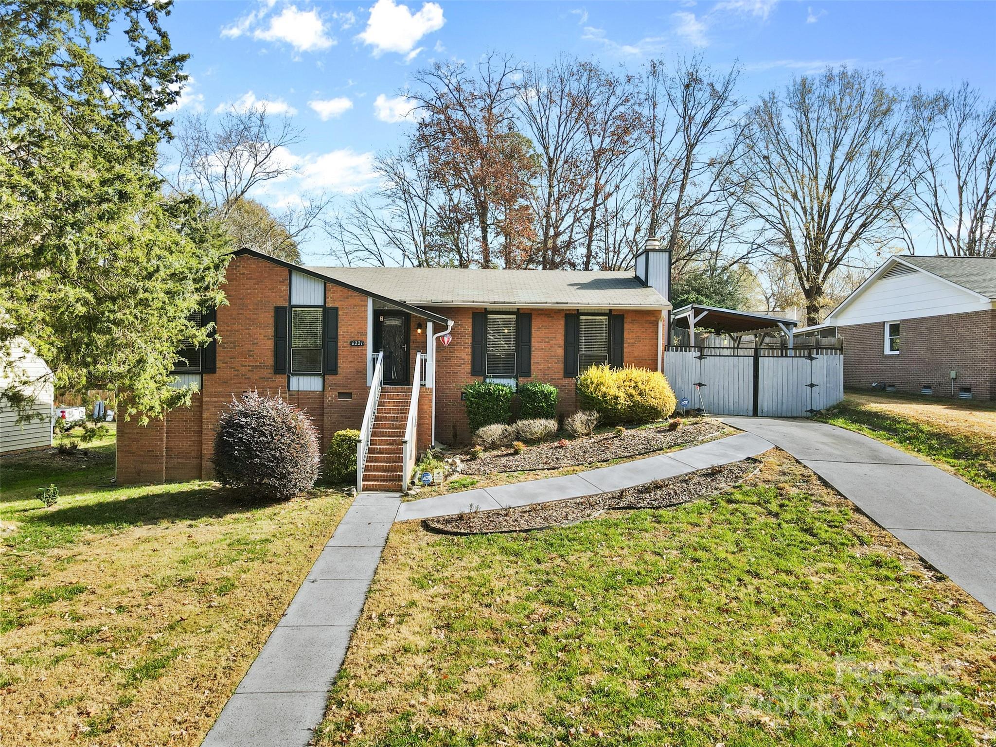 6221 Thermal Road Charlotte, NC 28211 - Photo 1 of 36 a front view of a house with garden