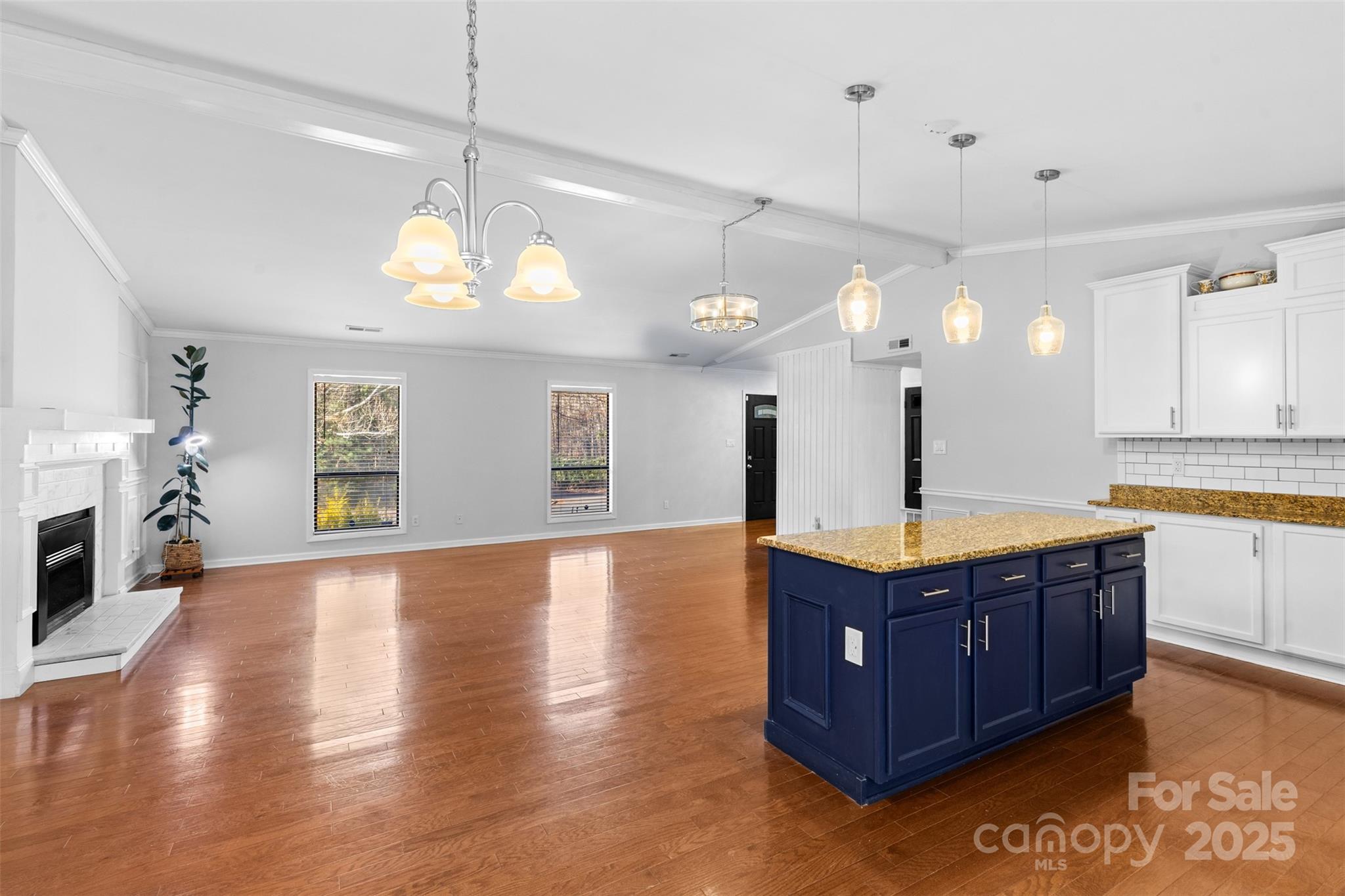 6221 Thermal Road Charlotte, NC 28211 - Photo 11 of 36 a kitchen with stainless steel appliances granite countertop wooden floors and a view of living room