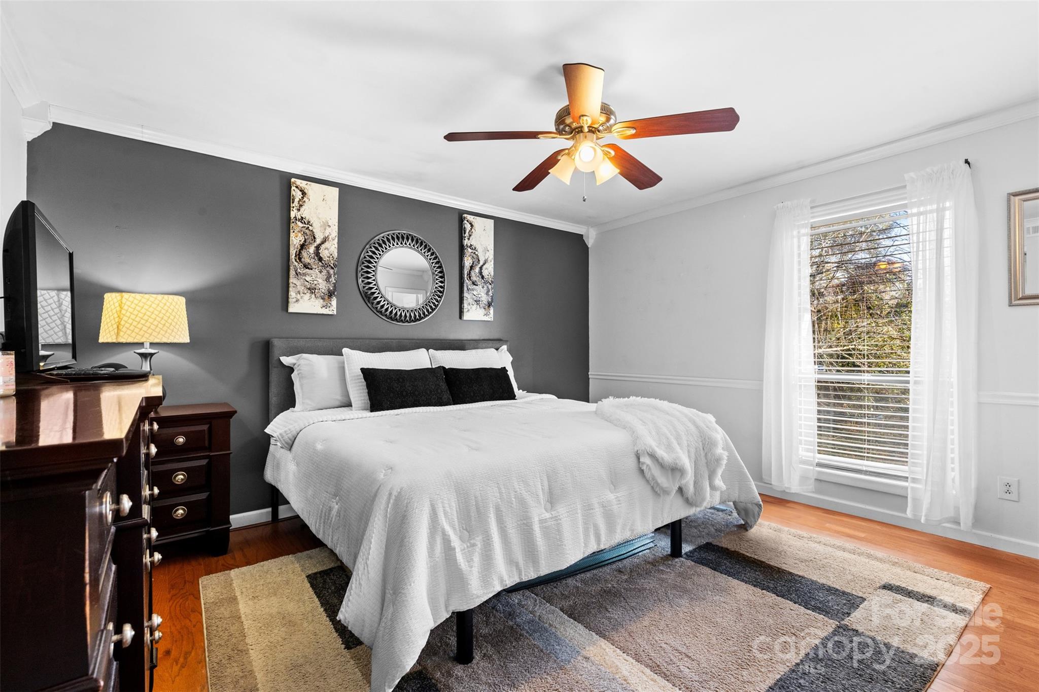 6221 Thermal Road Charlotte, NC 28211 - Photo 14 of 36 a bedroom with a bed and dresser with mirror