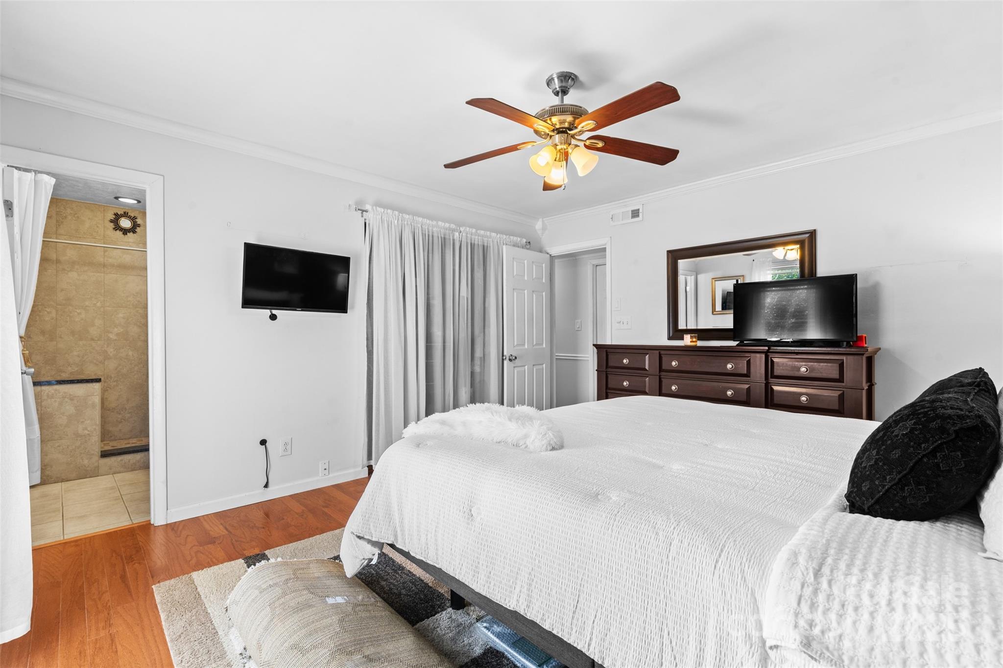 6221 Thermal Road Charlotte, NC 28211 - Photo 16 of 36 a bedroom with a bed and a flat screen tv