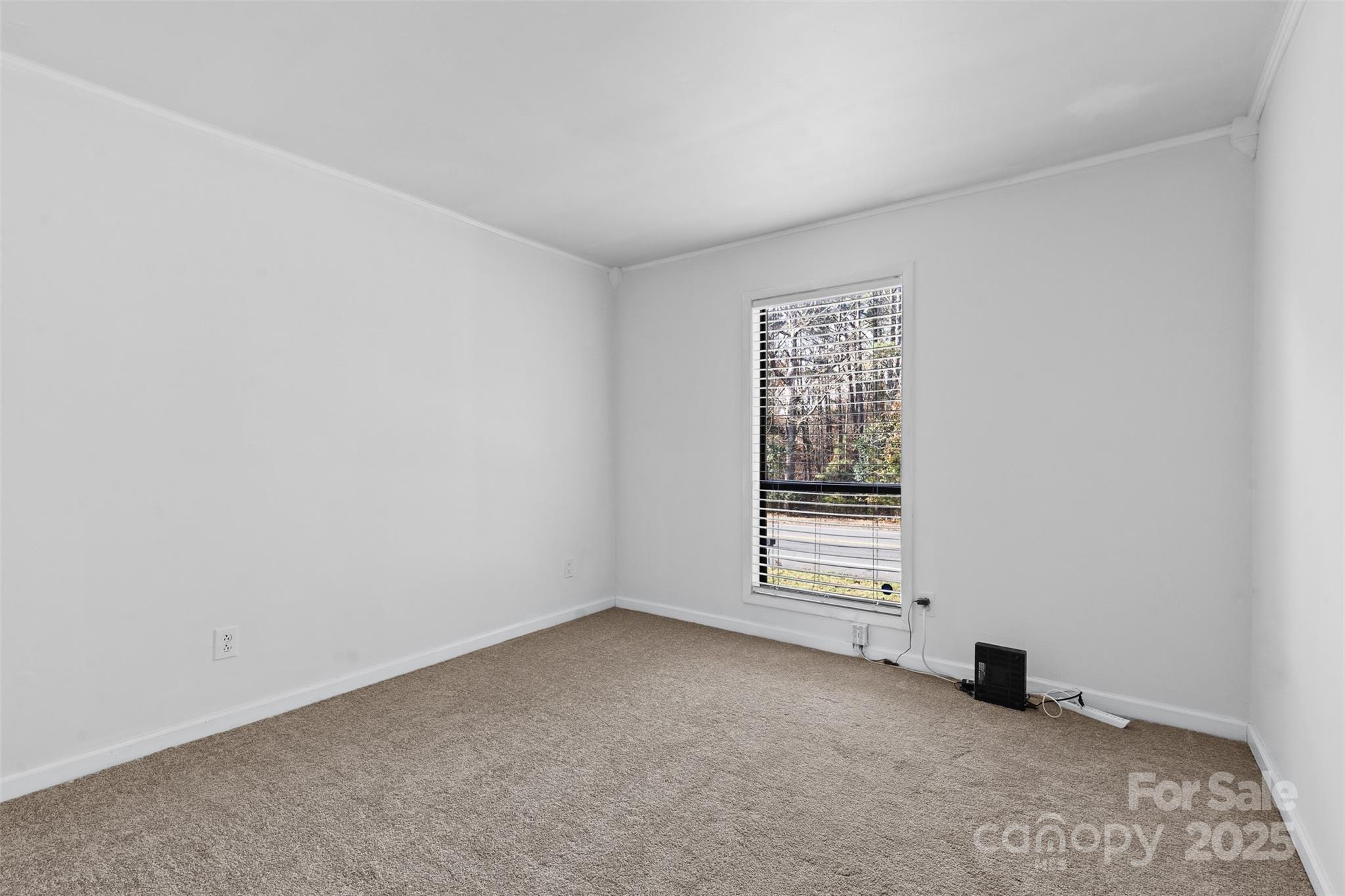 6221 Thermal Road Charlotte, NC 28211 - Photo 20 of 36 a view of an empty room with a window