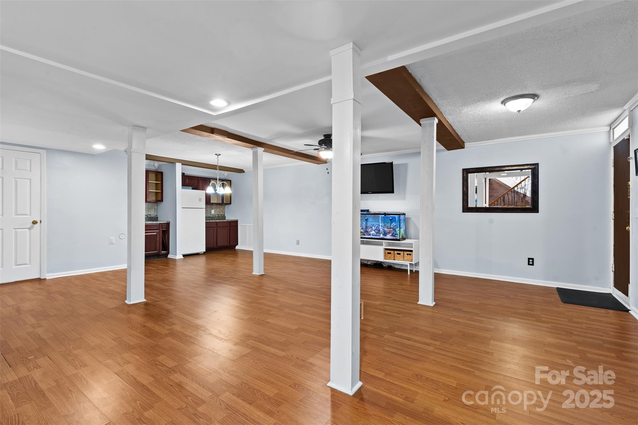 6221 Thermal Road Charlotte, NC 28211 - Photo 24 of 36 a view of a livingroom with wooden floor and a kitchen space