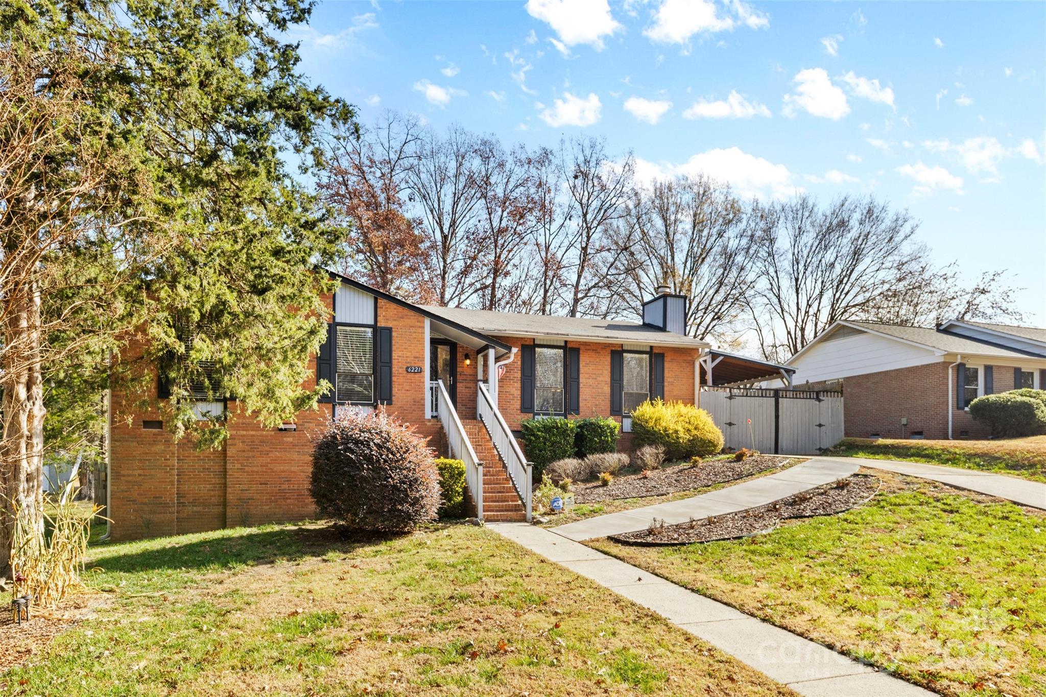 6221 Thermal Road Charlotte, NC 28211 - Photo 33 of 36 a view of a house with a yard covered in snow