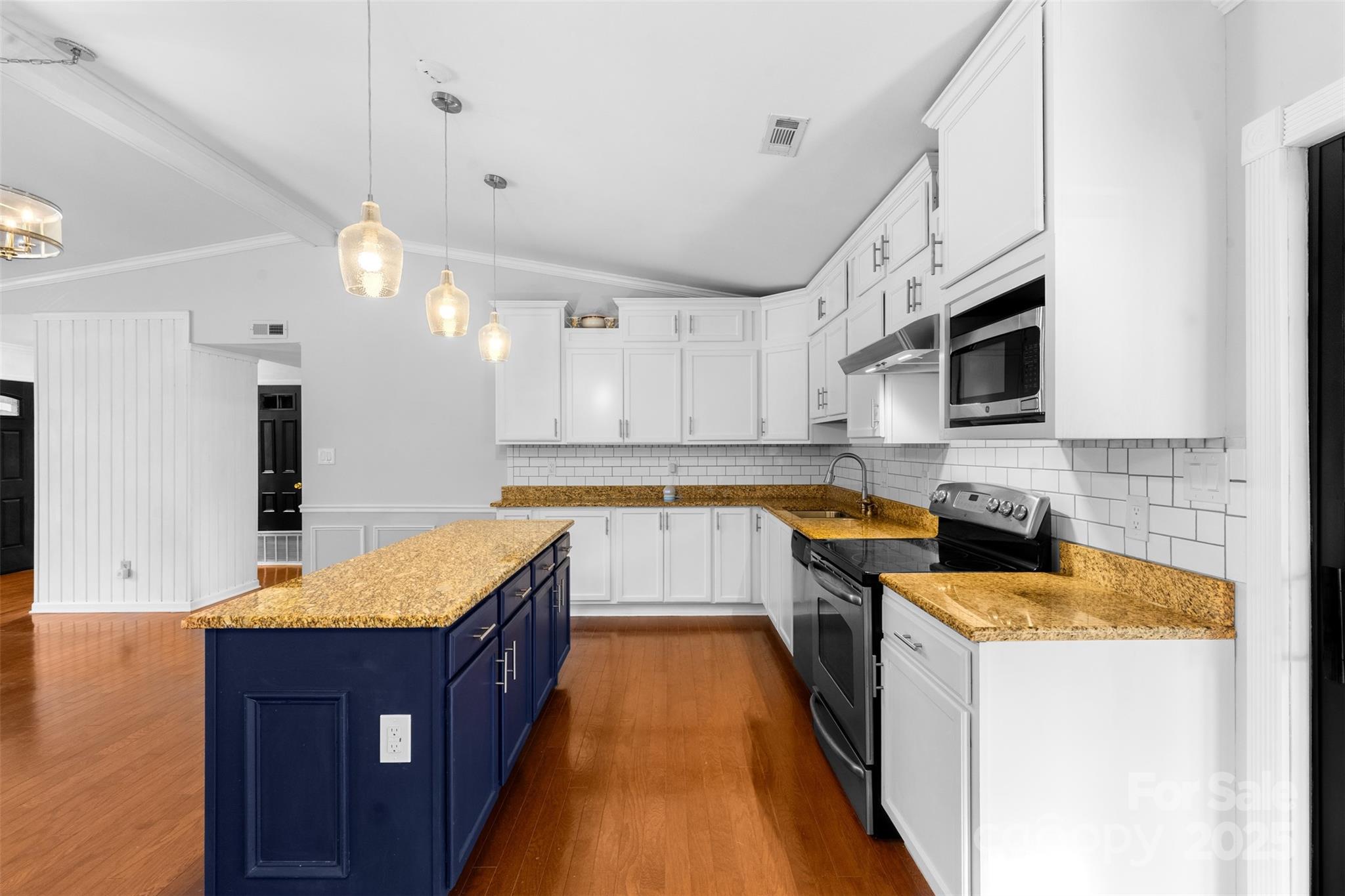 6221 Thermal Road Charlotte, NC 28211 - Photo 10 of 36 a large kitchen with stainless steel appliances granite countertop a stove a sink dishwasher and a microwave oven with large trees