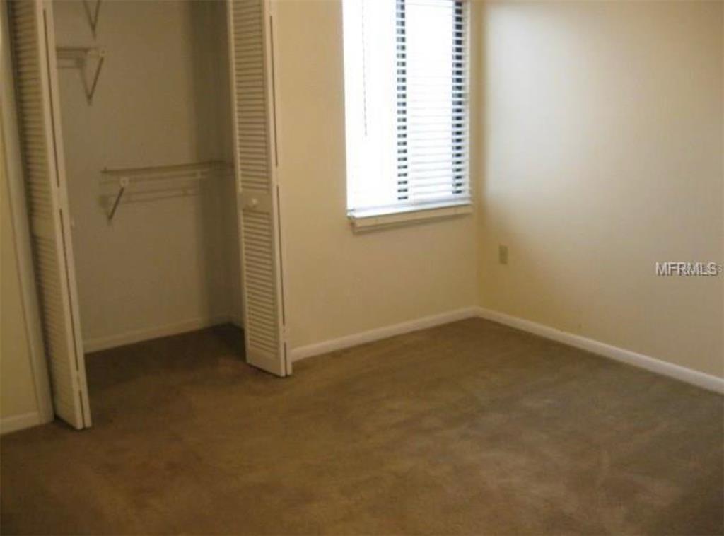 11450 Harbor Way, Unit 5002 Largo, FL 33774 - Photo 16 of 25 an empty room with a window