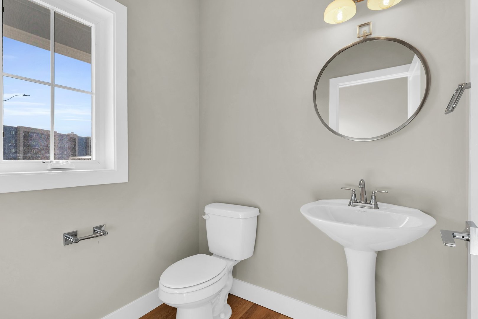 4518 Legends Drive Champaign, IL 61822 - Photo 32 of 44 a bathroom with a toilet sink and mirror