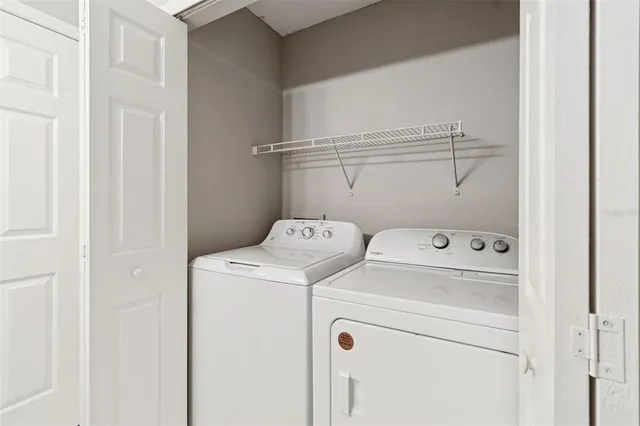 a view of a lake with houses in the back