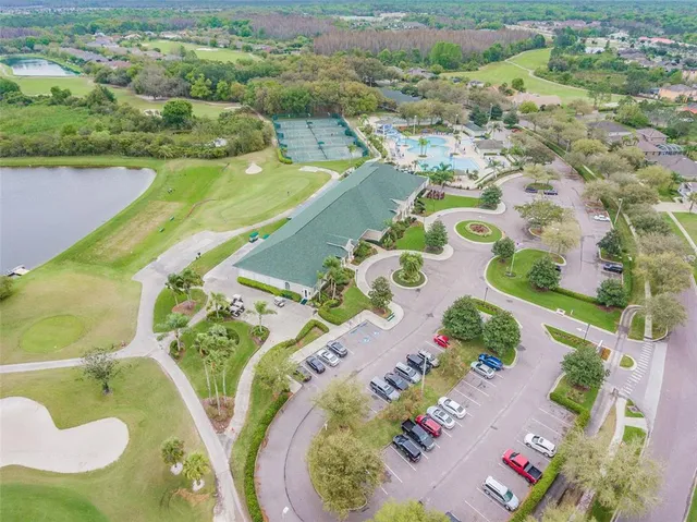 a view of a swimming pool and a yard