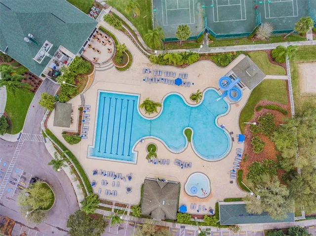 a front view of a house with a garden and plants