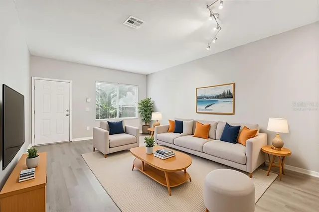 a living room with furniture and a large window