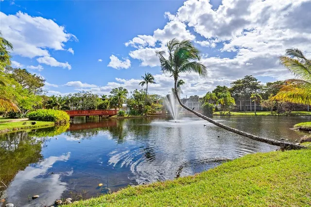 a view of a house with backyard porch and sitting area