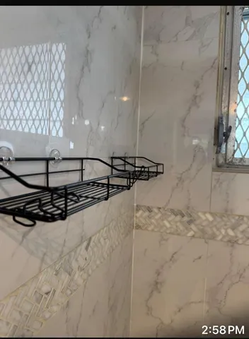 a bathroom with a sink and mirror with toilet